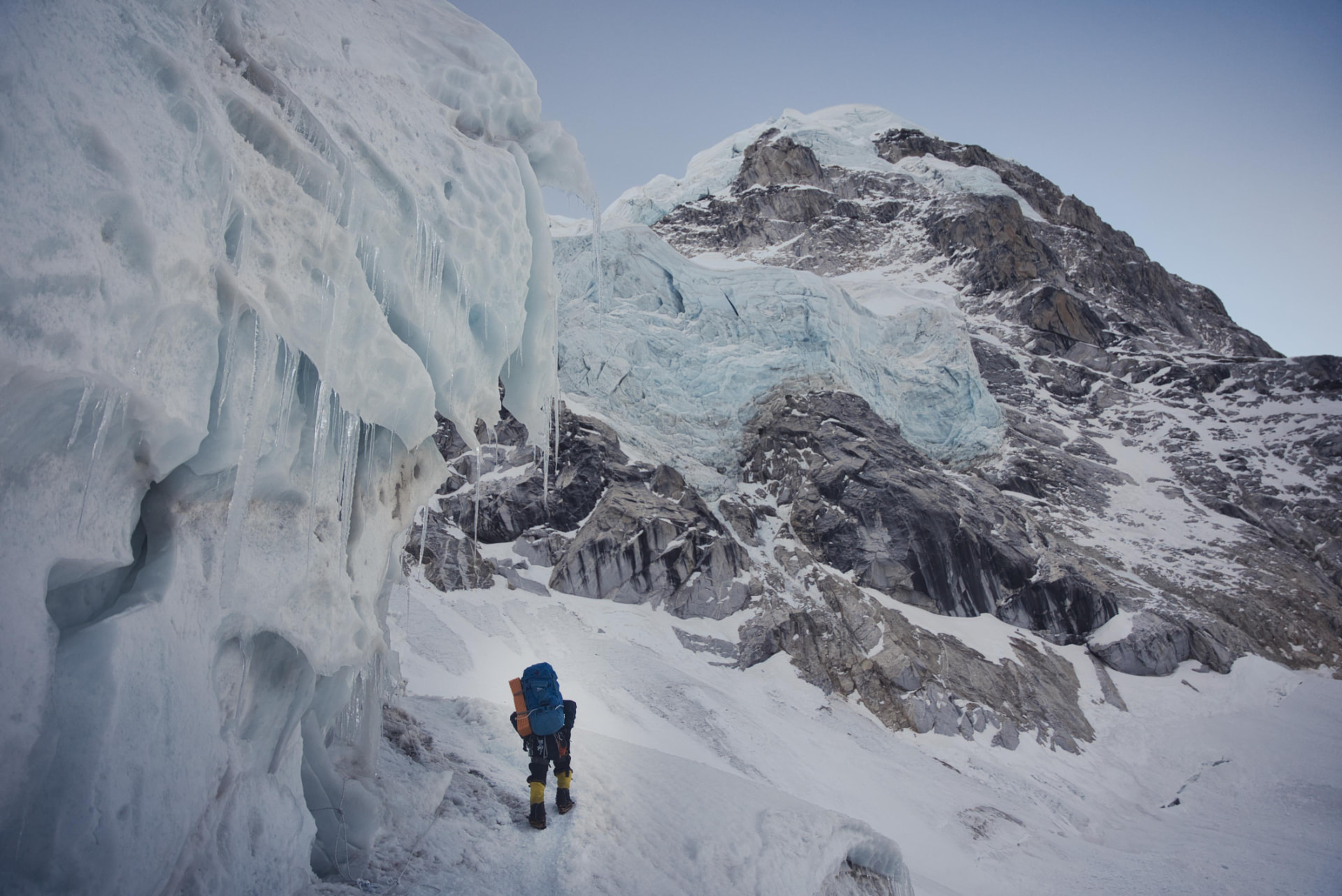A climber trekking through snow towards Everest Base Camp 2