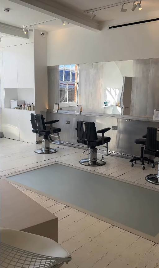 Cutting floor of SALT Salon with barber chairs and steel counters